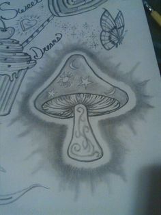 a drawing of a mushroom and some other things on it's back cover up