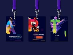 four tags with different designs on them hanging from lanyards in front of a dark background