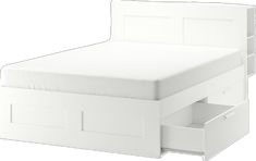 a white bed with two drawers on each side and an open drawer underneath the bed