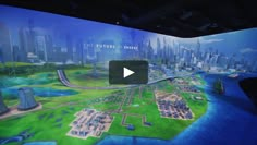 a video screen showing an overview of the future city