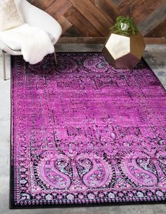 a purple rug with an intricate design on it