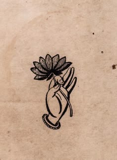 a drawing of a hand holding a flower