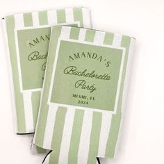 two green and white striped napkins with names on them