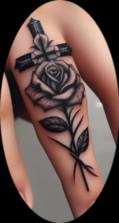 a rose with a cross tattoo on it