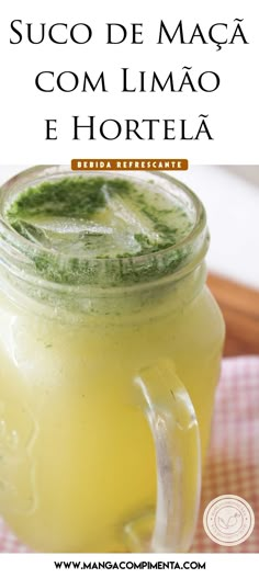 a mason jar filled with lemonade on top of a table