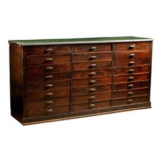 an old wooden dresser with many drawers