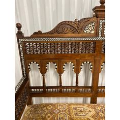 an antique wooden bed frame with intricate carvings