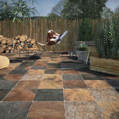 an outdoor patio with wood logs and chairs