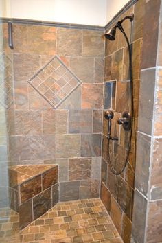 a walk in shower sitting inside of a bathroom