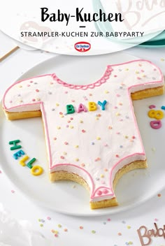 a baby - kuchen cake on a white plate with the word baby spelled out