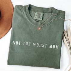 * Not the worst mom t-shirt is a simple and sweet gift for yourself or the humor loving mom in your life * Comfort Colors t-shirt made with 100% ring-spun cotton * Made with pre-shrunk cotton to maintain consistent sizing * Unisex relaxed style can make for a comfortable oversized look if desired * Soft material makes for great all day wear * Made and shipped from the US We believe in the "your satisfaction is our guarantee" motto!  Any questions or concerns please feel free to contact us! Cotton Slogan Tops As A Gift, Cotton Slogan Top For Gift, Cotton Slogan Tops As Gift, Inspirational Crew Neck Top As Gift, Everyday Crew Neck Tops For Mother's Day, Mother's Day Crew Neck Tops, Mom Tshirt, Sarcastic Mom Shirts, Mom Clothes