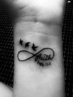 a wrist tattoo with three birds and the word faith on it's left side