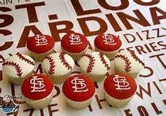 cupcakes decorated with red and white frosting are arranged in the shape of baseballs