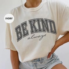 Embrace kindness with our Comfort Colors t-shirt featuring the bold collegiate-style "Be Kind Always" design.  This casual and stylish tee is perfect for anyone who believes in the power of kindness. Whether you're wearing it to inspire others or as a personal reminder, this tee combines comfort with a powerful message. 🛍️ HOW TO ORDER: 1️⃣To begin, select the desired product type and size from the drop-down menu. 2️⃣Next, choose the primary color and brand. 3️⃣Then, choose the desired quantity. 4️⃣Finally, click on the "Add to Cart" button. 🌟🌟If you're interested in purchasing another product with a different design or size, simply add it to your cart from the product page. ♦️ T-SHIRT: - 6.1 oz./yd² (US), 10 oz/L yd (CA), 100% ring-spun cotton, 30 singles - Garment dyed for that lived College Varsity T-shirt With Graphic Print, Oversized School Spirit T-shirt With Letter Print, Cotton Varsity T-shirt With Lettering, Casual T-shirt With Lettering For Game Day, Comfortable Slogan T-shirt For Streetwear, Trendy College T-shirt With Text Print, Trendy White T-shirt With Lettering, Collegiate Relaxed Fit Top With Text Print, College Style T-shirt With Text Print Crew Neck