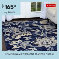 a blue rug with white flowers on it for $ 156 99 reg $ 800 00