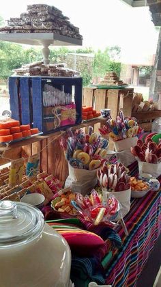 a table filled with lots of different types of candy and candies on it's sides