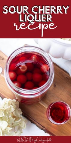 sour cherry liquer recipe in a jar on a cutting board next to flowers