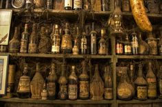 an old shelf filled with lots of bottles