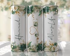 three personalized tumbles with flowers and hearts on them