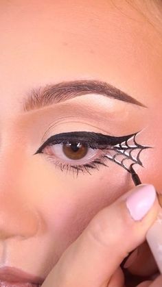 Halloween Spider Web Eyeliner, East Halloween Eyeliner, White Spider Web Makeup, How To Do Spider Web Eyeliner, Web Eyeliner Spider, Cobweb Eye Makeup, Spider Web Eyeliner Tutorial, Halloween Eyeliner Hooded Eyes, Spider Web Eye Makeup Easy