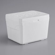 a large white cooler sitting on top of a table