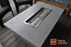 an outdoor table that is made out of concrete