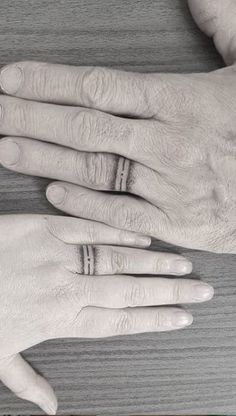 two people with wedding rings on their fingers