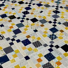 a close up of a quilt made with squares