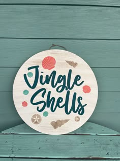 a wooden sign that says jungle shells on the side of a green wood plank wall