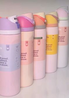 thermos are lined up in different colors