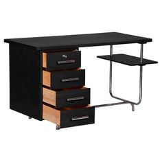 an office desk with three drawers and a shelf on one side, in black finish