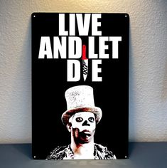 a black and white poster with the words live and let die on it's face