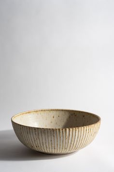 a white bowl sitting on top of a table