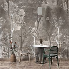 a table and chairs in front of a wallpapered forest scene with trees on it