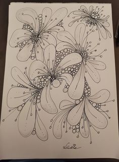 a drawing of some flowers on paper