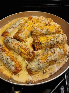 some food is being cooked in a pan on the stove top and ready to be eaten