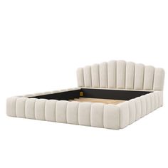 an upholstered white bed frame with black legs