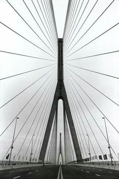 a black and white photo of a bridge