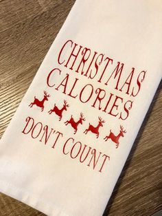 a tea towel that says christmas calories don't count