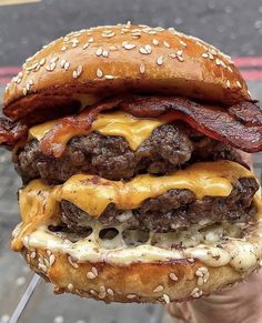 a hamburger with bacon and cheese on it