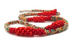 two necklaces with red, orange and blue beads