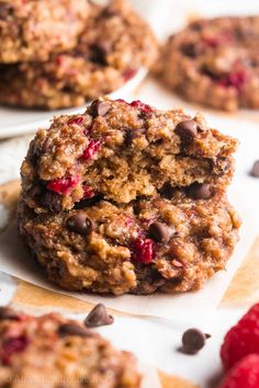 chocolate chip cookies with raspberries and oatmeal are stacked on top of each other