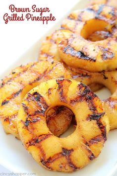 grilled pineapple rings on a white plate