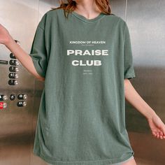 🔥🔥 IMPORTANT NOTICE: In case you come across this design elsewhere, please be aware that it has been taken without authorization from our store. This design has been created by me.🔥🔥 Enjoy our cozy retro inspired "Kingdom of Heaven New Jerusalem Praise Club" shirt. Great fall season loungewear or gift for friend, roommate or sibling in Christ, share the message of worship with this Christian sweatshirt THIS SHIRTCOMES IN: Moss, Ivory, Pepper, Black, Blossom, Expresso, Crimson COMORT COLORS T Church Merch Ideas, Church Merch, Black Blossom, Premium Aesthetic, Minimalist Shirts, Merch Ideas, Christian Tshirt, Fitted Shirts, Kingdom Of Heaven