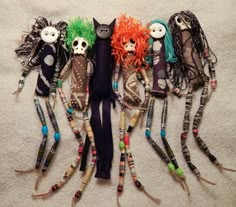 several dolls are arranged in the shape of a group with long hair and colorful wigs