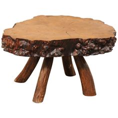 a table made out of logs and wood