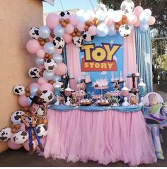 a toy story birthday party with balloons and decorations