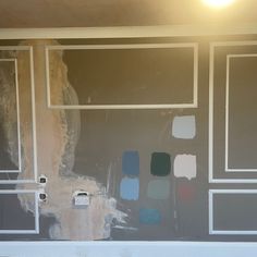 a room with some paint on the walls and one wall has been stripped off to reveal different colors