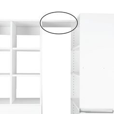 an empty white bookcase with shelves on each side and a black circle above it