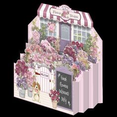 a pink flower shop with flowers and a dog on the front door is shown in this card